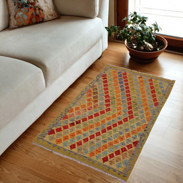 Add a touch of elegance to your home with this casual chic hand woven Tribal Kilim wool rug. Constructed on a loom by...
