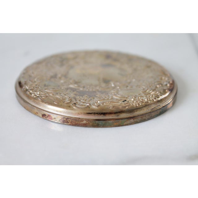 Vintage Towle Sterling Silver repousse hand held mirror. Makers stamp on the side. Some minor wear, tarnishing.