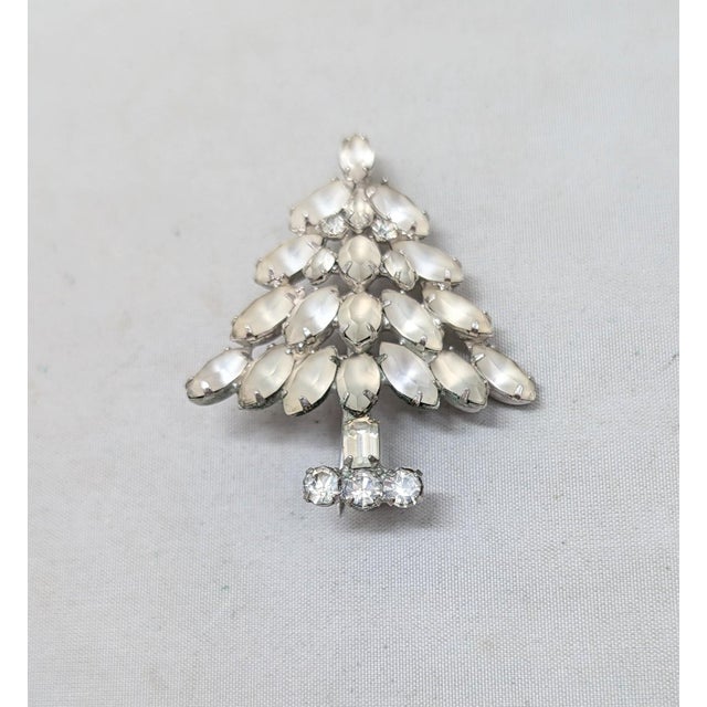 Circa 1950s-1960s rhodium plated prong set marquise white frosted rhinestones with small round clear rhinestone accents...
