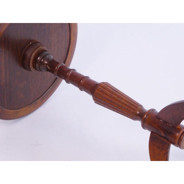 Beautiful English Victorian style wooden table with a red leather top with golden details. Very useful to place at any...