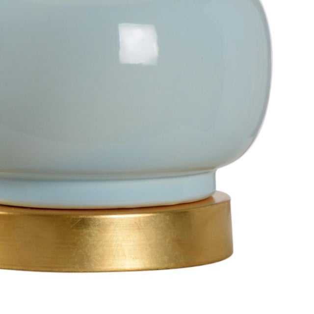 Sigrid lamp features a transitional design that blends effortlessly in any space. A robin's egg blue glaze is applied to a...