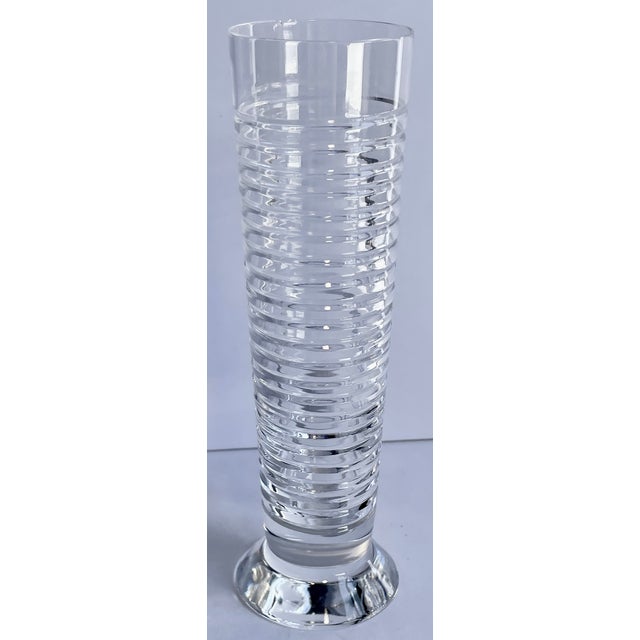 A pretty little ribbed cut crystal bud vase with “Ralph Lauren” etched on the bottom of the chunky base.