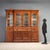 Late 19th-century mahogany bookcase from England, composed of three distinct sections with a protruding central element....