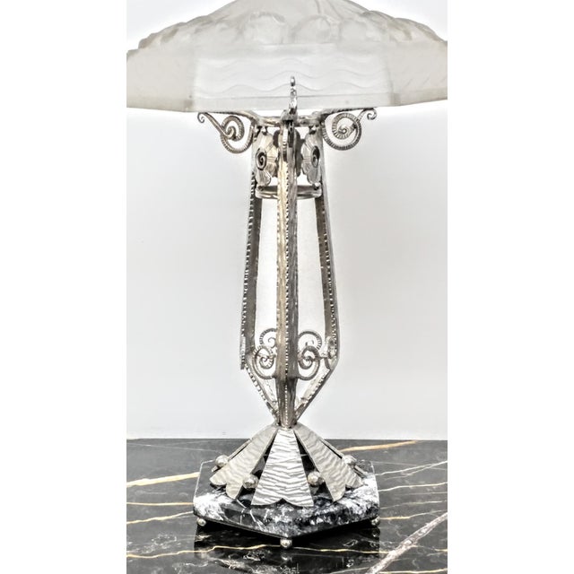French Art Deco hand forged wrought iron table lamp. Decorated with fine intricate stylized symmetric with geometric...
