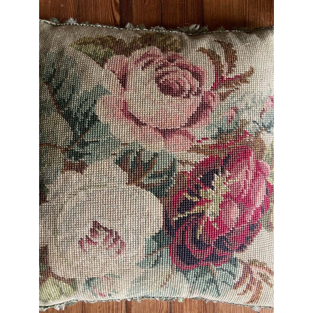 Very pretty authentic 19th century down filled French Needlepoint pillow. It has beautiful fringes and the back is velvet....