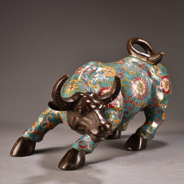 This striking vintage statue depicts a powerful ox, the second animal in the Chinese zodiac, cast in a dynamic, charging...