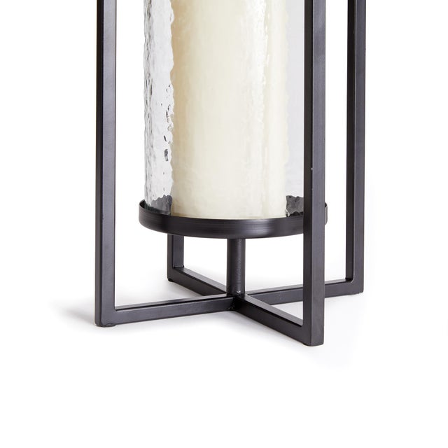 Mondrianinspired, simple geometric shapes with intersecting planes make for a contemporary look. This indoor lantern is...