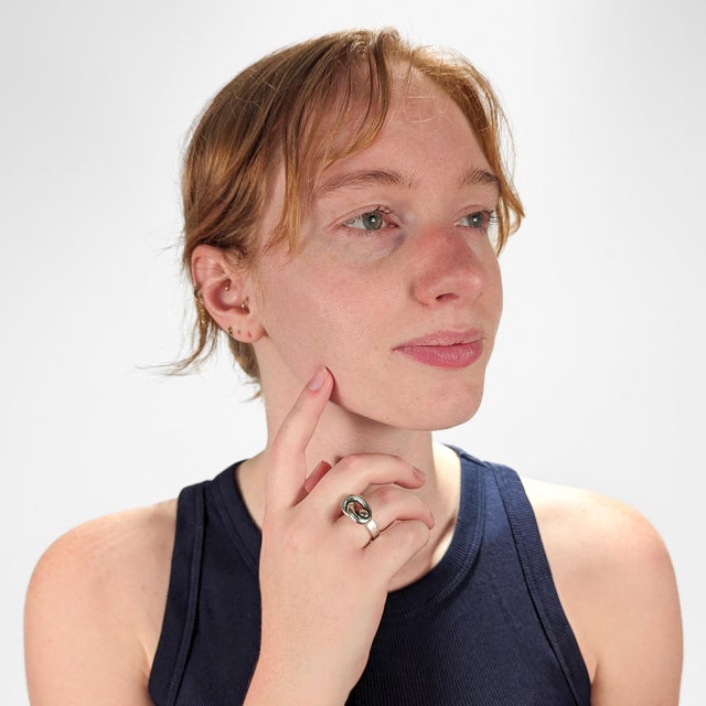 A fine band ring. By Puig Doria. In sterling silver. With a pretzel shaped knot to the top supported by a hand wrought...