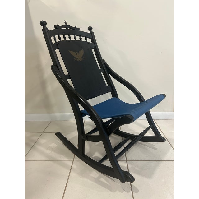 This is a classic piece of Americana—a vintage 1976 Bicentennial folding rocking chair. Featuring a striking black finish...