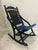 This is a classic piece of Americana—a vintage 1976 Bicentennial folding rocking chair. Featuring a striking black finish...