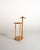 Beech frame with a shaped coat hanger, a storage tray with two circular slots, a trouser bar, and a lower shelf....