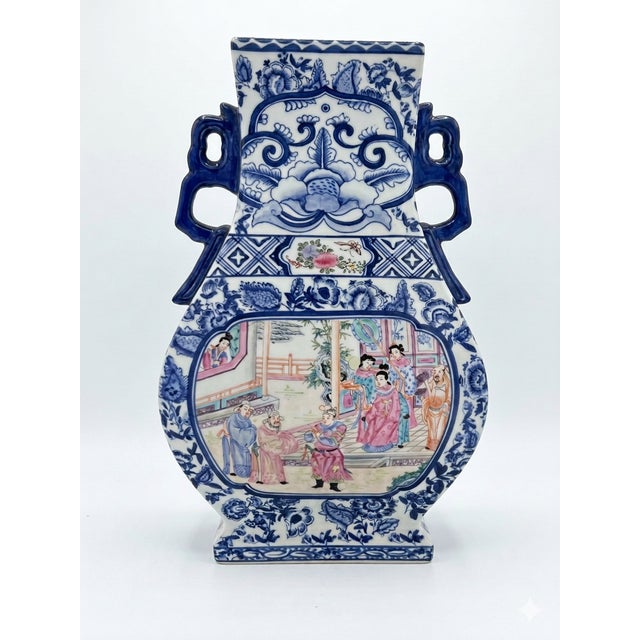 Blue and White Chinese polychrome porcelain vase with intricate, colorful hand-painted court scenes on the belly. The form...