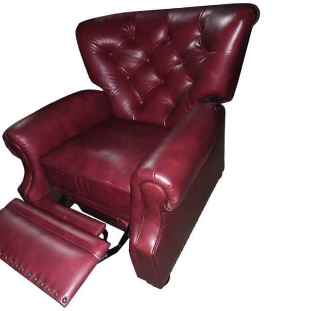 Luxurious Classic wingback Chesterfield leather recliner by Pottery Barn Features: Luxurious Leather: Upholstered in rich,...