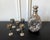 A set of Chinese Export silver drinking set consists of a pinch bottle and five cordials circa 1910s-1920s. Featuring...