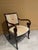 Add a touch of classical elegance to your space with this striking Empire Revival upholstered armchair. Masterfully...