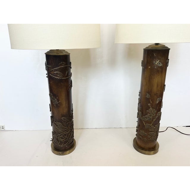 Pair of vintage wood and raised metal wallpaper roller lamps with lovely dragonflies and foliage. 36” H to finial Base 6”...