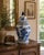 A large blue and white porcelain ginger jar decorated with continuous Chinoiserie landscapes of pagodas, garden pavilions,...