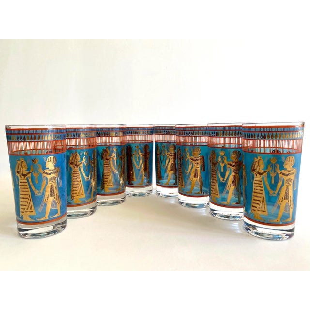 This set of eight rare vintage 1960's Mid Century Modern Egyptian Revival gold leaf highball tumbler glasses is an...