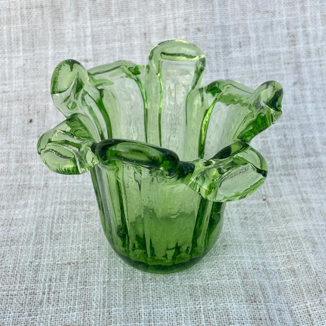Small green glass catchall in great shape. Appears to be handcrafted. Unfortunately, it doesn’t glow under UV Light, so...