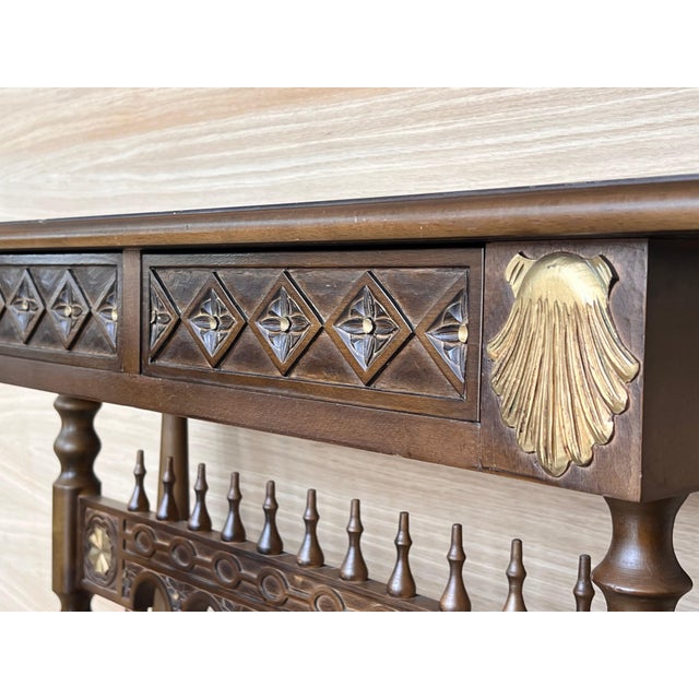 Castilian mid century console table in walnut with two front drawers in gold leaf. Beautiful console in walnut and gold...
