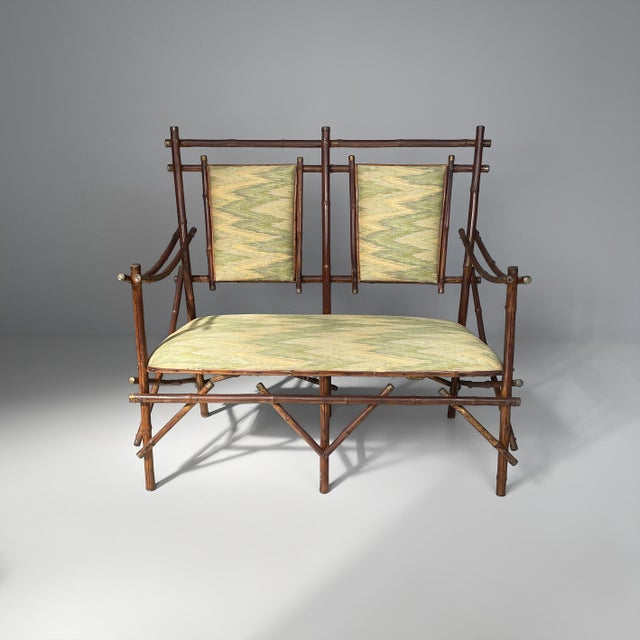 Italian art deco sofa in fabric and bamboo, 1930s Two-seater sofa with a dark brown bamboo frame, characterized by...