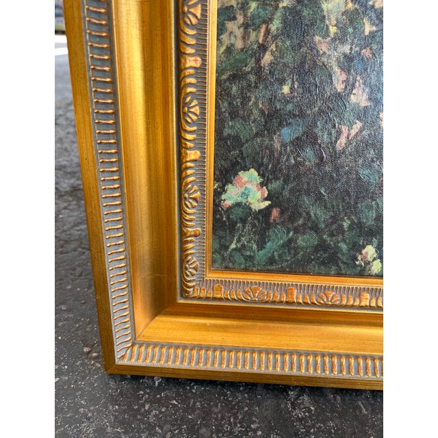 This framed wall art print is a reproduction of "A Girl with a Watering Can" by Pierre-Auguste Renoir. Beautiful gold wood...