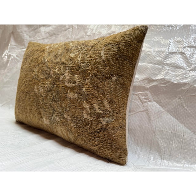 This antique pillow is crafted from a fragment of an authentic 17th century Brussels tapestry, renowned for the...