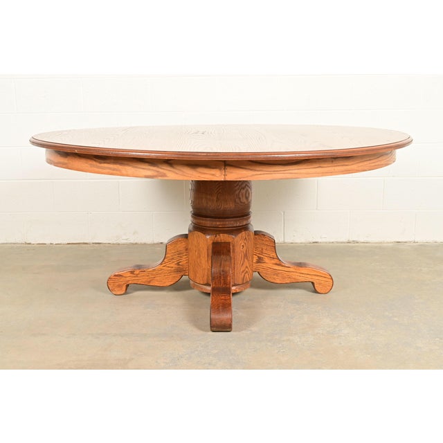 A gorgeous Mission, Arts & Crafts, or Late Victorian style oak pedestal dining table In the manner of Stickley USA, Circa...