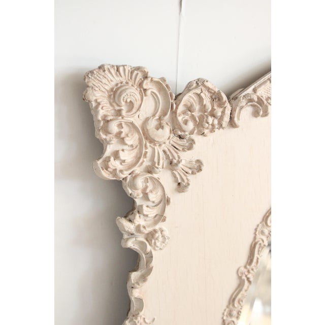 This vintage painted wall mirror is one of our favorites, with its scalloped edges, scroll relief all the way around it's...