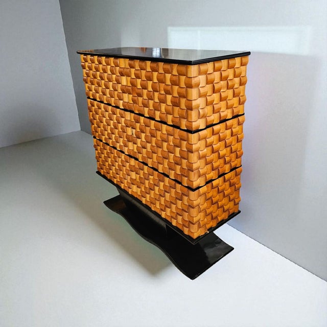 Beautiful bar cabinet in maple and ebony wood with brass finishes. Inside, there is lighting that turns on when the door...