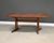 A mid century modern rounded rectangular solid cherry dining table with a pedestal base and two 19.375” leaves which fully...