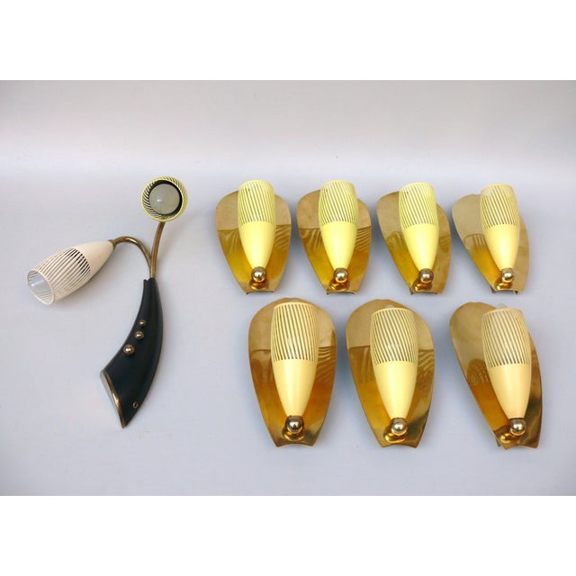 An extraordinary set of wall lights, manufactured by Gebr. Cosack in the typical design language of the 50s. The large...