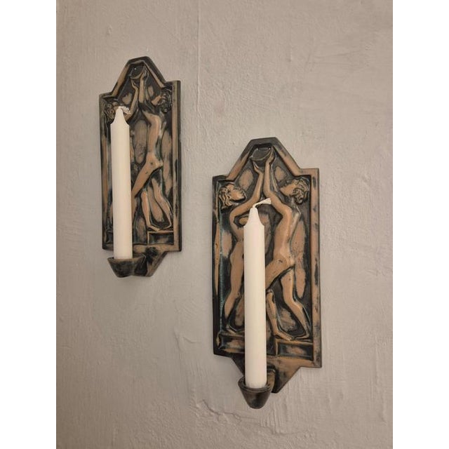 A rare pair of wall candle holders by swedish manufacturer founded in 1925, Gabriel Keramik. Beautiful decor of a man and...
