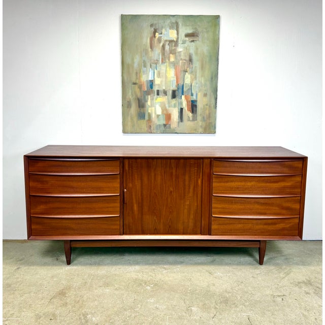 A gorgeous mid century Danish modern credenza / long dresser designed by Svend Aage Madsen for Falster a Mobelfabrik,...