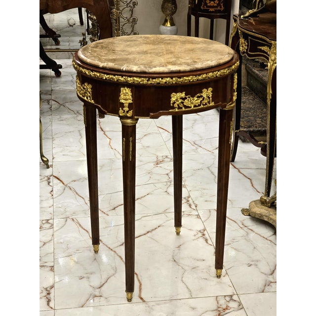 This Baroque style side table is a luxurious statement piece that combines classic French elegance with functional design....