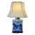 Blue and White Porcelain Tea Jar Table Lamp Decorated With an Asian Landscape Scene Resting on a Wooden Base With Cream Colored Lampshade For Sale