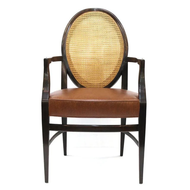 Beautiful set of four mid century modern armchairs with caned backs and faux leather seats. Desirable rosewood frames....