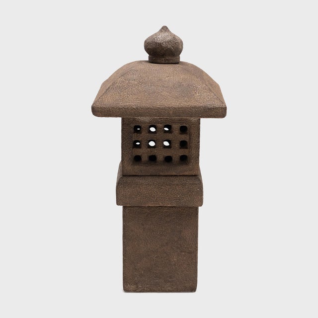 Sculptural lanterns of carved stone or wood are traditionally placed throughout Buddhist temple grounds or courtyard...