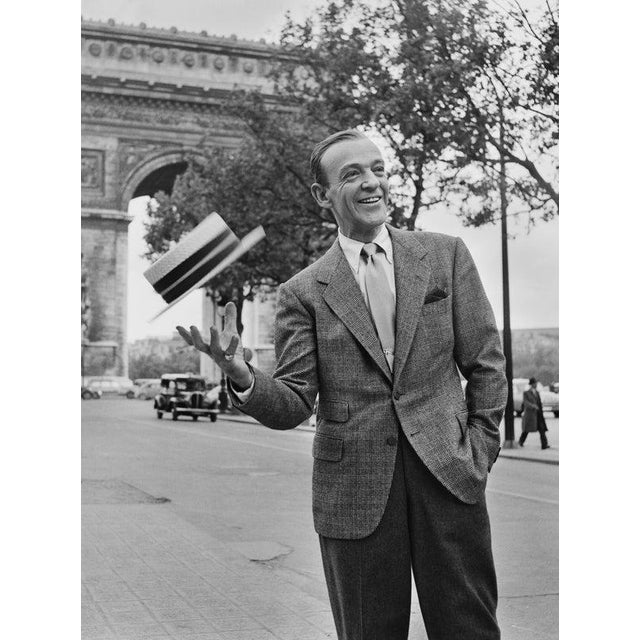 Fred Astaire 7th July 1956: Actor and dancer Fred Astaire (1899-1987) poses in front of the Arc de Triomphe in Paris,...