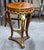 Add a touch of timeless European luxury to your home with this exquisite French Empire-inspired side table, meticulously...