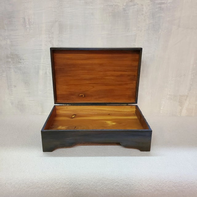 A small vintage cedar keepsake/jewelry box newly painted a washy dark blue. Inside and outside has a warm, low-sheen,...