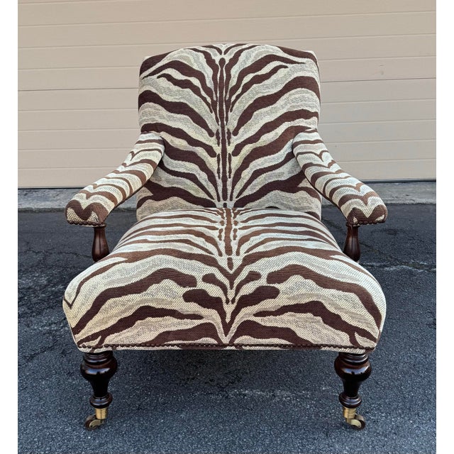 George Smith Edwardian Style Chair and Ottoman in zebra patterned chenille like fabric on turned legs with brass casters....