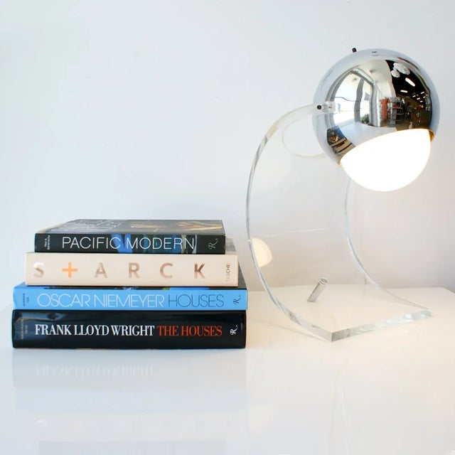 1960s-70s Mid Century Modern curved lucite and chrome ball table lamp. Adjustable angle chrome ball. Good vintage...