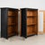 Pair of 20th century bookcases, crafted in pine and given a newer black painted finish. Long glass panels provide generous...