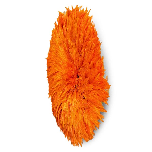 Beautiful vintage hand crafted original JuJu hat wall art. Vibrant orange feathers. These attractive bird feather art form...
