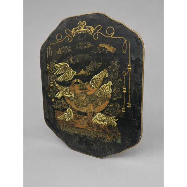 An evocative nineteenth-century painted tôle fire screen or chimney panel, fashioned from shaped sheet metal and...