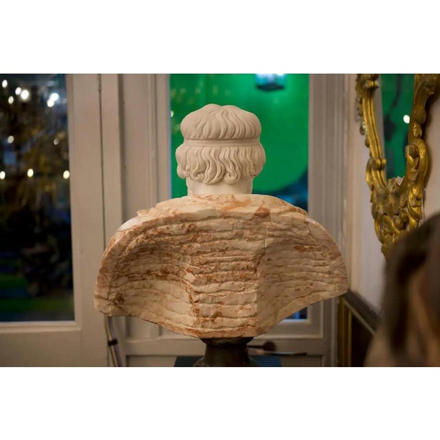 A large 20th Century Bust of Roman Hand Carved in Carrara White and Alicante red marble. Hand carved by craftsmen using...