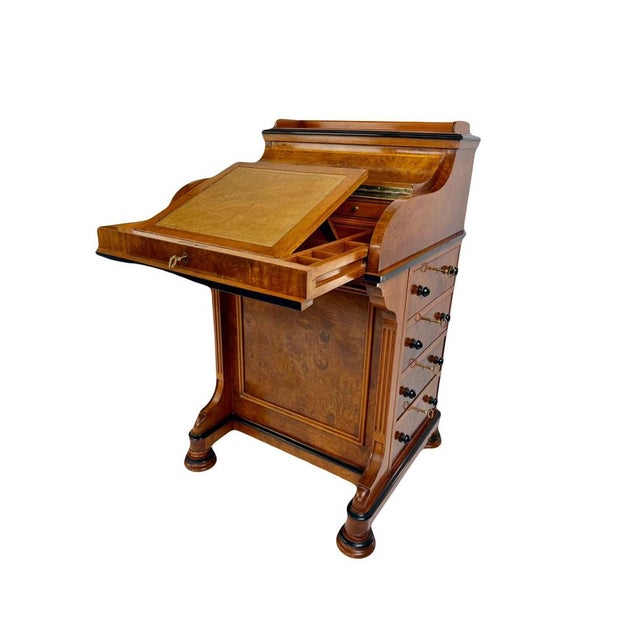 We offer this remarkable English Davenport desk, a true embodiment of the refinement and ingenuity of Victorian...