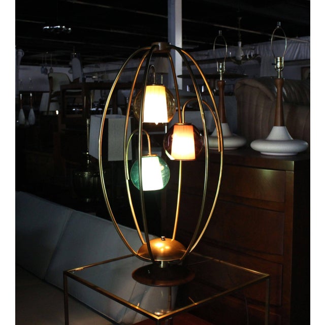Very nice Mid-Century Modern brass "cage" table lamps with colored glass shades.