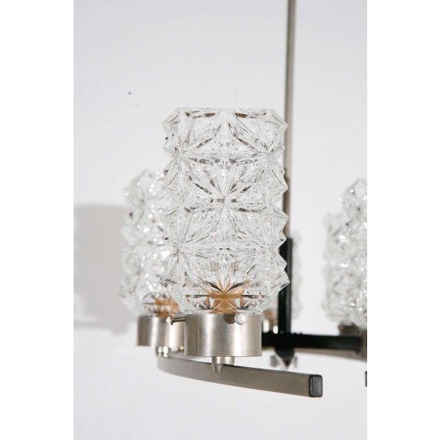 Modernist Italian fixture with ice shades Newly wired with candelabra sockets, each socket can take up to a 60 watt bulb.